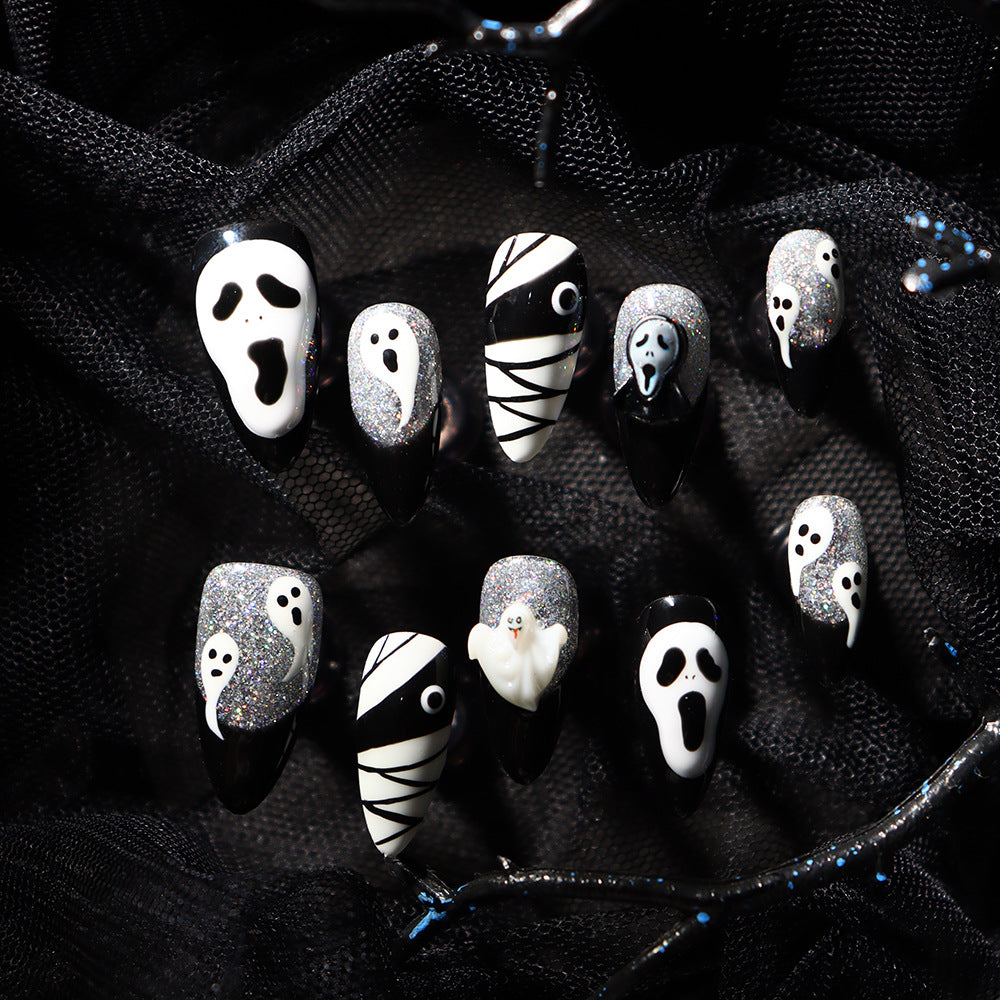 Close-up of Haunted House Design on Medium Almond Press On Nails